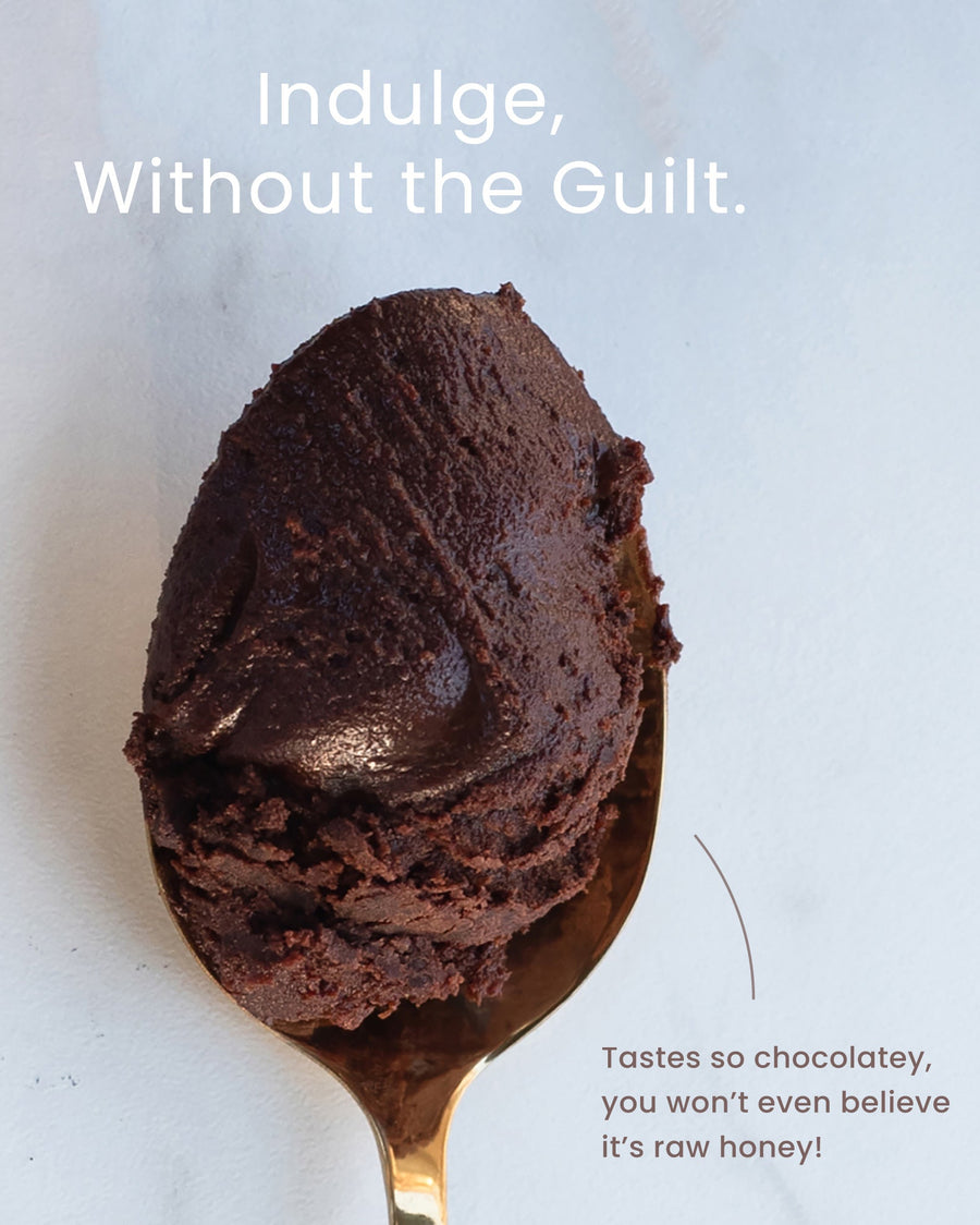 Spoon with chocolate raw honey  on a light background, text 'Indulge, Without the Guilt.'